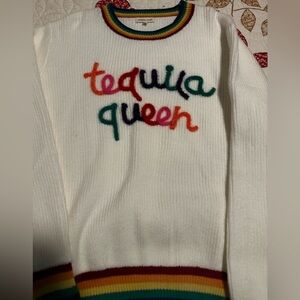 Sweater with rainbow colored collar.